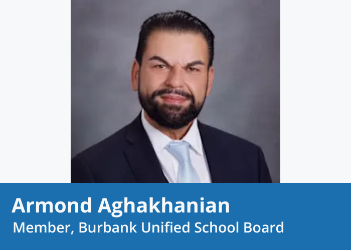 Portrait of a man in a suit with dark hair and a dark beard smiling. Blue banner at Bottom with white text "Armond Aghakhanian Member, Burbank Unified School Board"